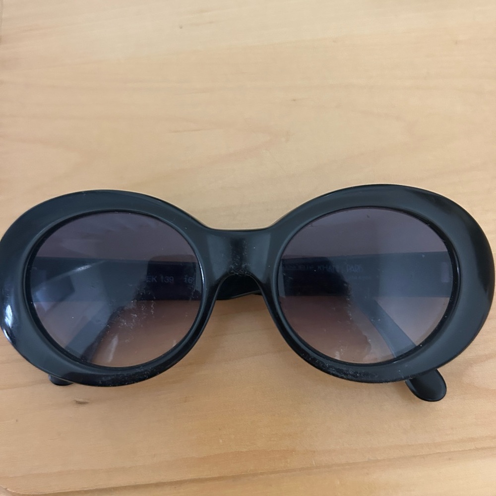 Emmanuelle Khanh black oval sunglasses